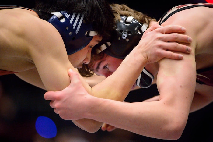 (Trent Nelson | The Salt Lake Tribune)  Brighton's Anthonee Ouk (left) and Maple Mountain's Cole Tierre Patterson, 5A State Championships, high school wrestling quarterfinals in Orem, Wednesday February 7, 2018.