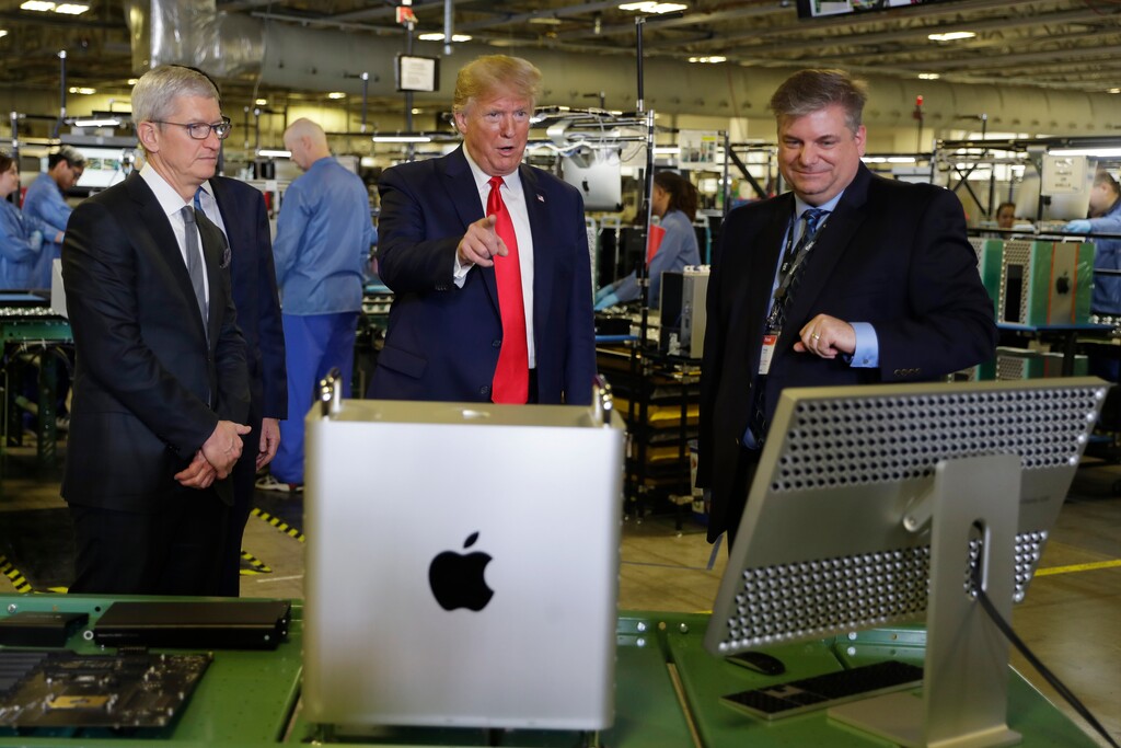 President Donald Trump tours an Apple manufacturing plant, Wednesday, Nov. 20, 2019, in Austin with Apple CEO Tim Cook, left. (AP Photo/ Evan Vucci)