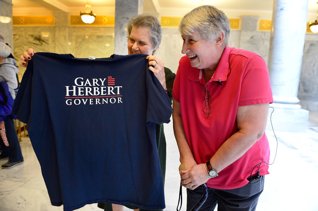 Scott Sommerdorf | The Salt Lake TribuneMarlene Jennings, right, a former delegate for Gary Herbert when he ran for Governor, shows the shirt to Dorothy Owen, left, who also opposes SB234. Jennings later gave  back the shirt to the Governor's staff over the issue of the inland port and SB234, Thursday, March 14, 2018.