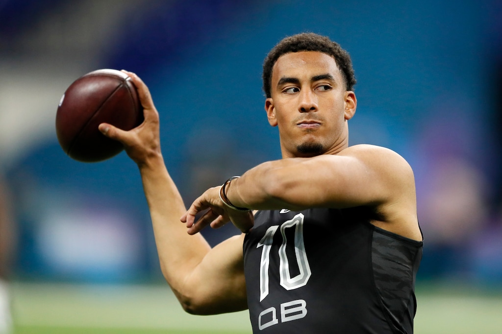 FILE - In this Thursday, Feb. 27, 2020, file photo, Utah State quarterback Jordan Love works out at the NFL football scouting combine in Indianapolis. The Green Bay Packers have signed each of their two top draft picks now that they’ve agreed to terms with Love and Boston College running back A.J. Dillon, the team announced Wednesday, July 1, 2020. (AP Photo/Charlie Neibergall, File)