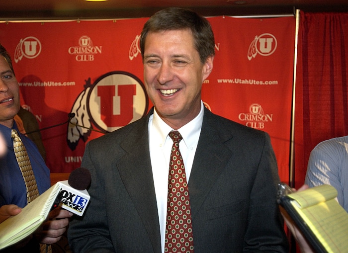 (Tribune File Photo)  Dr. Chris Hill, Director of Athletics at The University of Utah, is all smiles as he answers questions about his pick for Utah's new head basketball coach, Ray Giacoletti, on March 31, 2004.