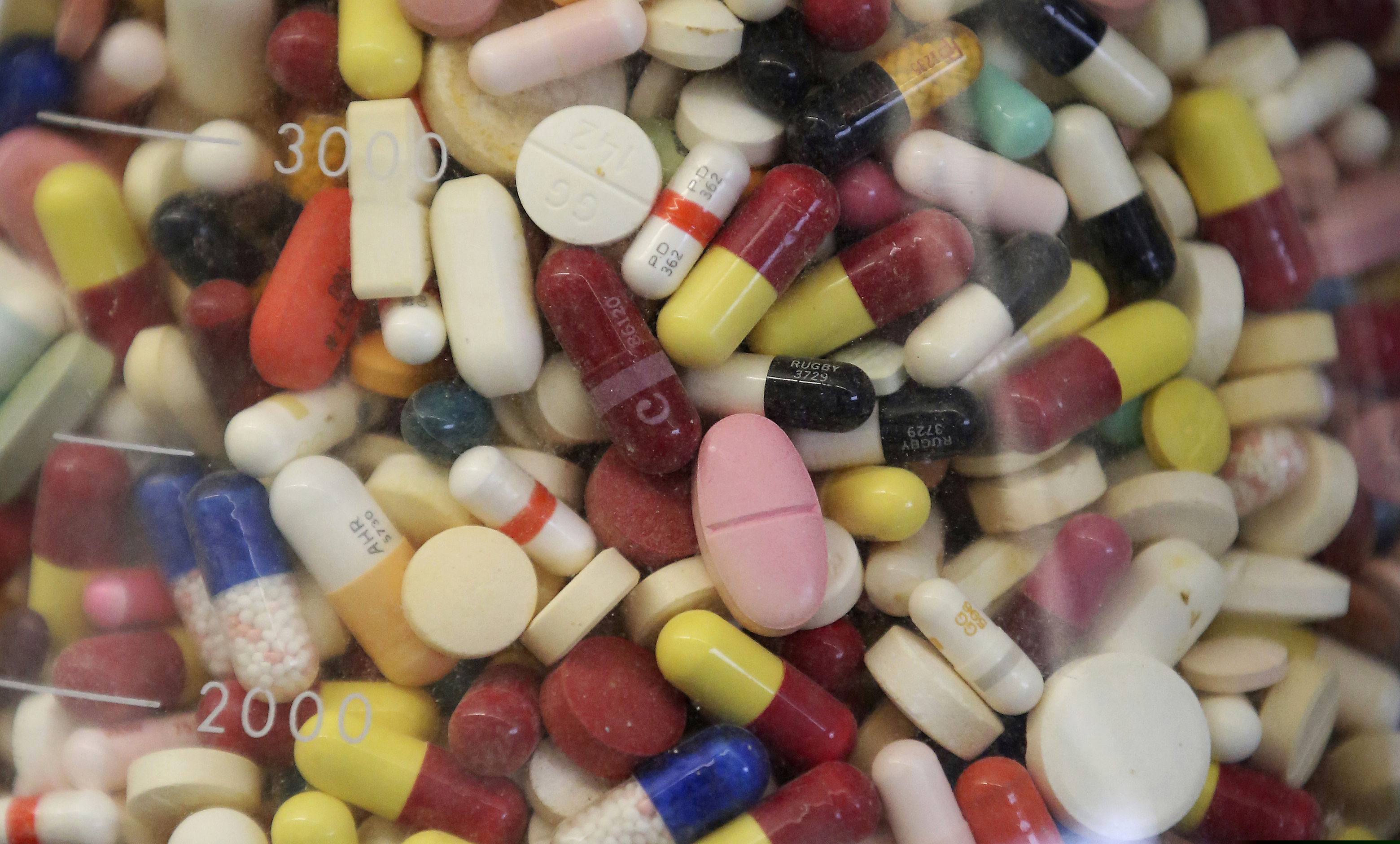 (Rick Bowmer | AP Photo) This July 6, 2017, file photo shows prescription drugs in a glass flask at the state crime lab in Taylorsville, Utah. According to The Washington Post. the price of generic alternatives seems to be declining, but the same does not appear true for branded drugs.