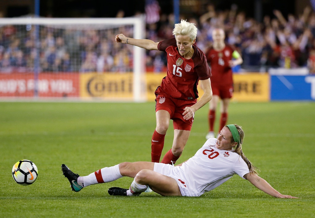 United States forward Megan Rapinoe (15) and Canada midfielder Maegan Kelly (20) battle for the ball during the first half of an international friendly women's soccer match, Sunday, Nov. 12, 2017, in San Jose, Calif. (AP Photo/Eric Risberg)