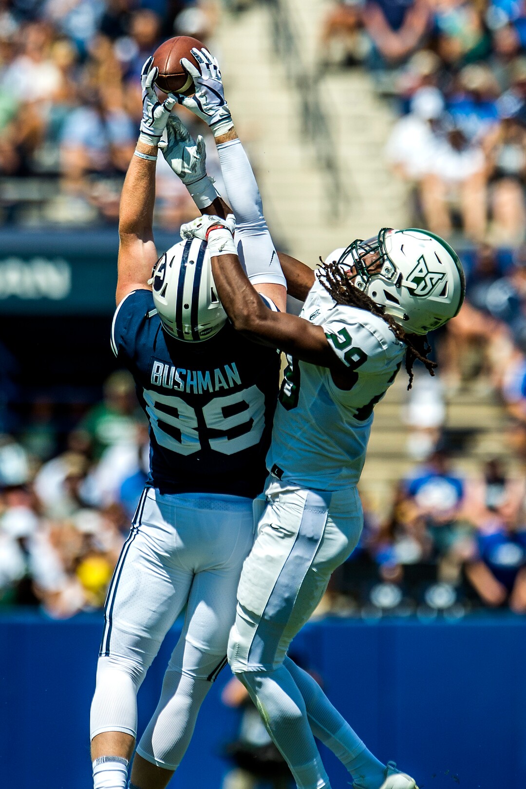 (Chris Detrick  |  The Salt Lake Tribune)  Brigham Young Cougars tight end Matt Bushman (89) makes a catch over Portland State Vikings cornerback Donovan Olumba (29) during the game at LaVell Edwards Stadium Saturday, August 26, 2017.