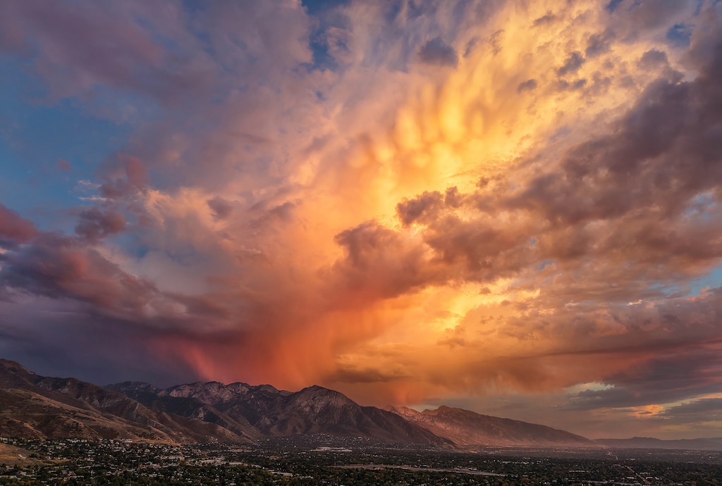 (Francisco Kjolseth | The Salt Lake Tribune) The sky lights up over Mount Olympus in the setting sun on Wednesday, Oct. 7, 2026.