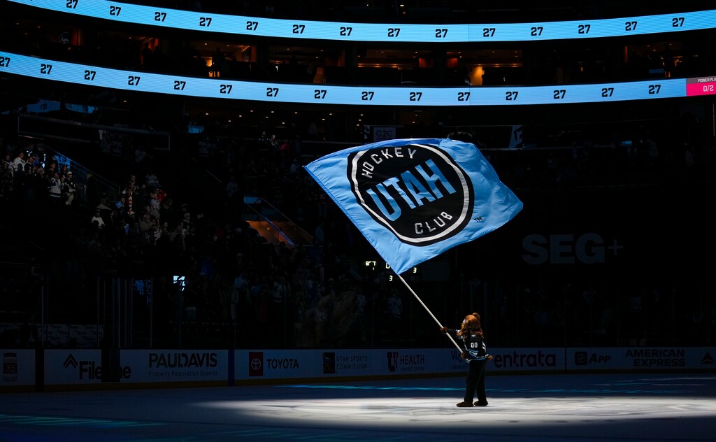 (Bethany Baker  |  The Salt Lake Tribune) Bear, the mascot for the Utah Hockey Club, waves a flag on the ice after the Utah Hockey Club defeated the Calgary Flames at the Delta Center in Salt Lake City on Tuesday, April 1, 2025.