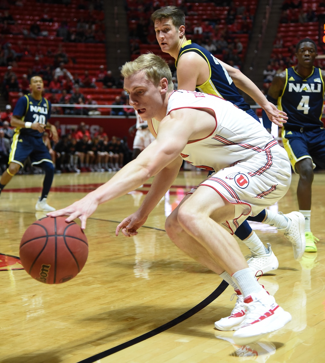 (Francisco Kjolseth  |  The Salt Lake Tribune)  Utah Utes guard Parker Van Dyke (5) tries to regain control of the ball over Northern Arizona in Men's Basketball at the Jon M Huntsman Center in Salt Lake City, Utah, on Friday, Dec. 21, 2018.