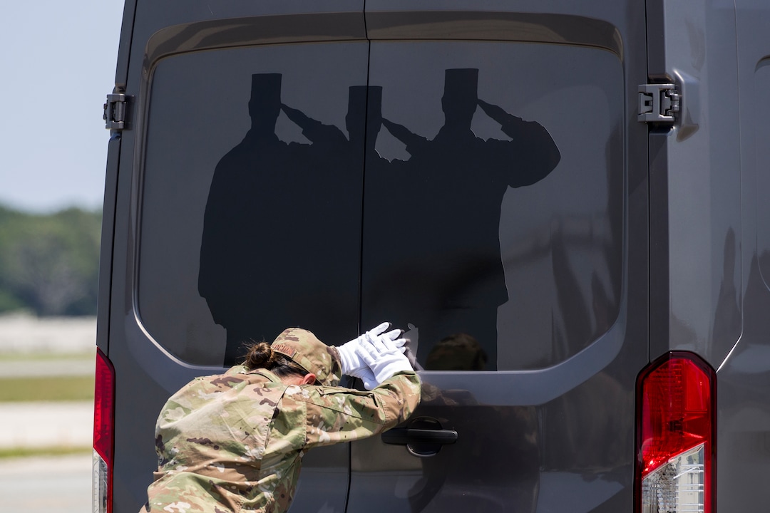 (Alex Brandon  |  AP Photo) Senior Airman Siannie Concepcion closes the doors on a vehicle containing a transfer case containing the remains of U.S. Army Sgt. 1st Class Elliott J. Robbins, at Dover Air Force Base, Del., Tuesday, July 2, 2019. According to the Department of Defense, Robbins, of Ogden, Utah, assigned to the 10th Special Forces Group died while supporting Operation Freedom's Sentinel.