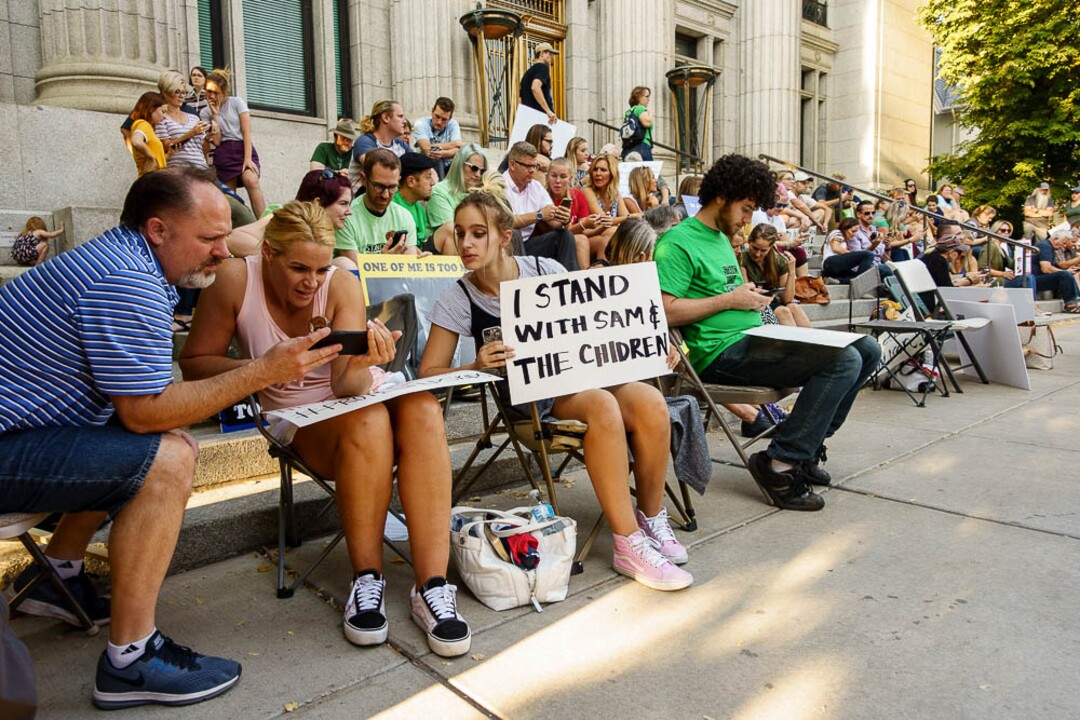 (Trent Nelson | The Salt Lake Tribune)  People watch as Sam Young speaks on a livestream after his hearing. People gathered in front of the LDS Church Administration Building Salt Lake City, Sunday Sept. 9, 2018 in support of Sam Young. Young was in a disciplinary hearing tonight after he made calls for changes to the church's youth interview process.