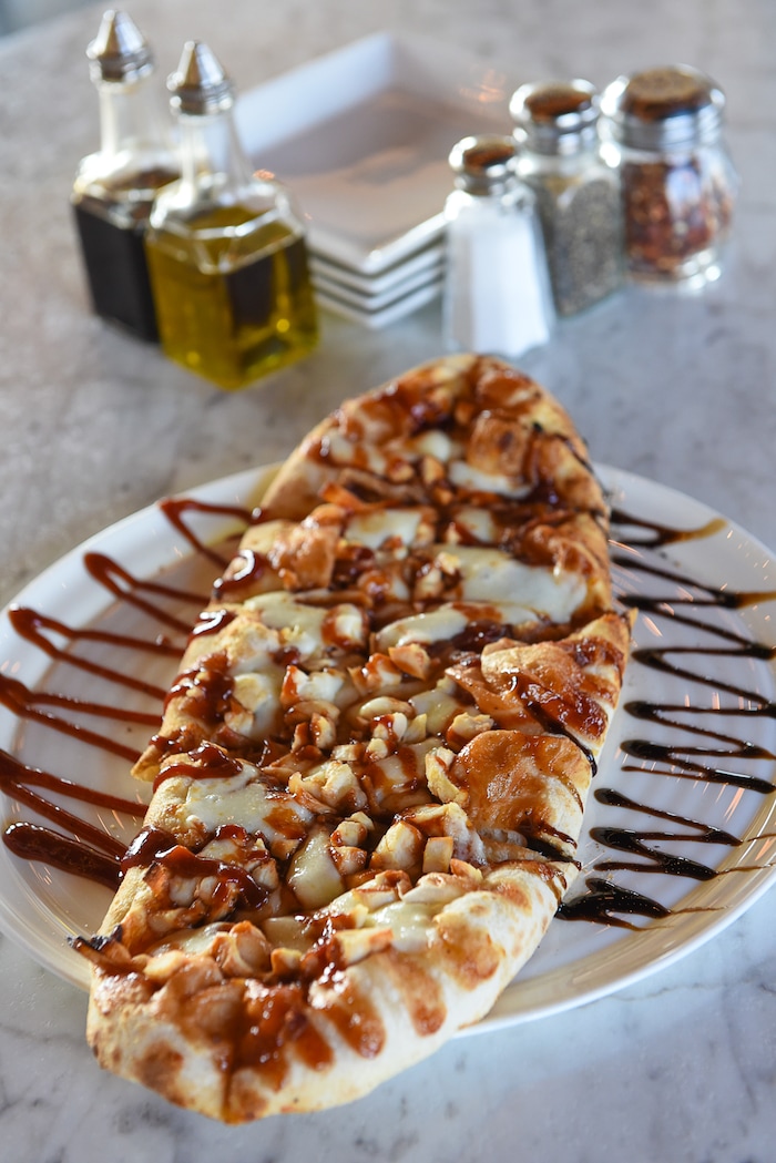 (Francisco Kjolseth | The Salt Lake Tribune) Focaccia Americana featuring BBQ sauce, onion, chicken breast and mozzarella from Terra Mia Italian restaurant in Draper, a sister restaurant to Terra Mia in Orem.
