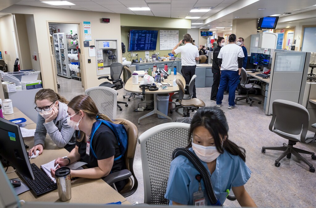 (Charlie Ehlert | University of Utah Health) Health care workers attend to patients in the intensive care unit at University Hospital in Salt Lake City, Wednesday, March 9, 2022.