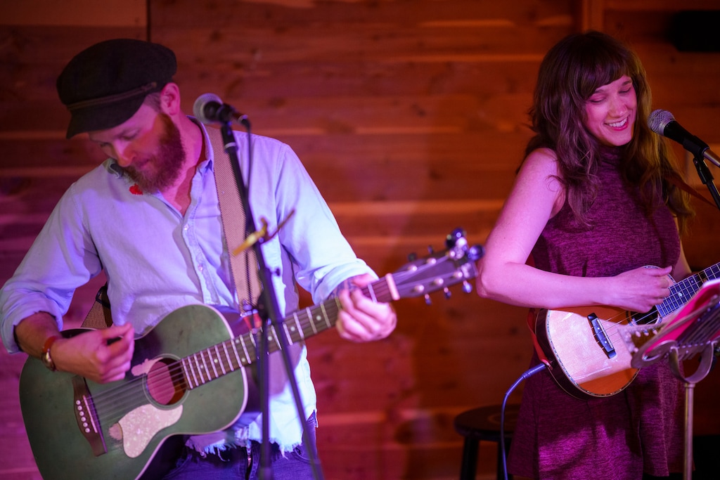 (Trent Nelson  |  The Salt Lake Tribune) The folk duo Little Lonesome, made up of Chase Gillins, left, and Steph Clotele, performs at the Carriage House Sessions open mic night at Cafe 140B in Salt Lake City on Monday, July 3, 2023.
