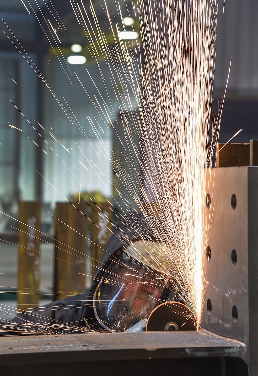 (Francisco Kjolseth  |  The Salt Lake Tribune)  Brook Matthews at Structural Steel and Plate Fabrication in North Salt Lake uses a grinder on a large order bound for a Morton Salt plant in Grantsville. Recent metal tariffs implemented by the Trump administration though a boom for steel producers has negatively impacted metal fabrication businesses creating numerous challenges.  