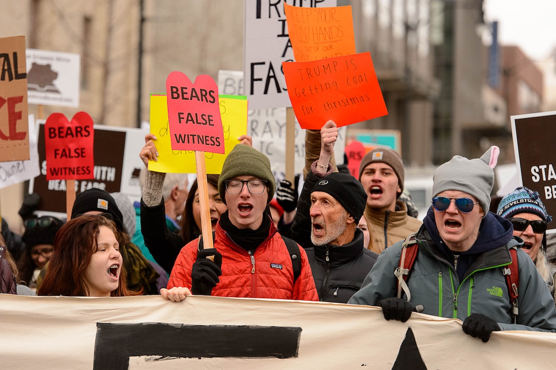 (Trent Nelson | The Salt Lake Tribune)  Protesters block off an intersection downtown after a rally against a visit by President Donald Trump, Monday December 4, 2017.