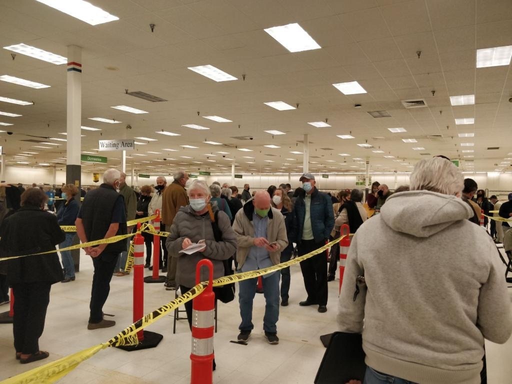 Photo by Jessica Berrett. People waiting in line inside the Spanish Fork COVID-19 vaccination clinic.