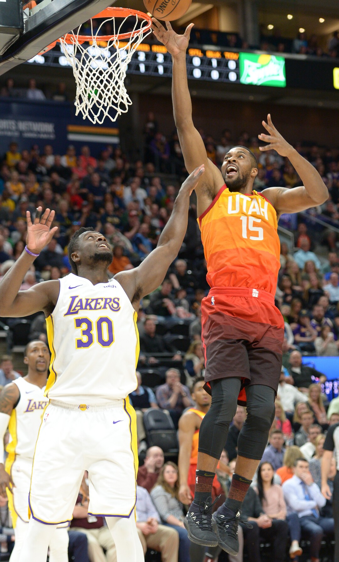 (Leah Hogsten  |  The Salt Lake Tribune)  Utah Jazz forward Derrick Favors (15) hits the net as the Utah Jazz host the Los Angeles Lakers at Vivint Smart Home Arena Tuesday, April 3, 2018