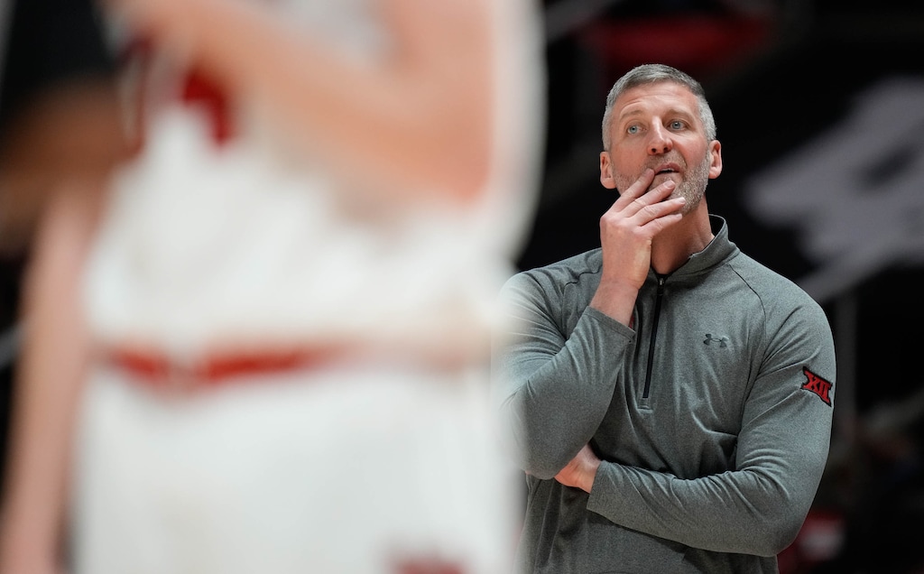 (Francisco Kjolseth  | The Salt Lake Tribune) Utah men’s basketball interim coach Josh Eilert keeps an eye on the game as Utah hosts West Virginia, NCAA basketball in Salt Lake City, Tuesday, March 4, 2025.