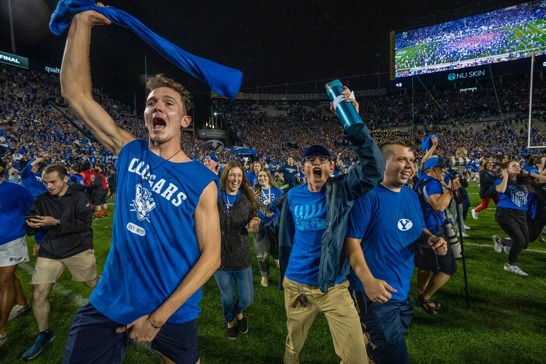 (Rick Egan | The Salt Lake Tribune) BYU fans storm the field as the Brigham Young Cougars defeat the Utah Utes 26-17, at Lavell Edwards Stadium in Provo, on Saturday, Sept. 11, 2021.