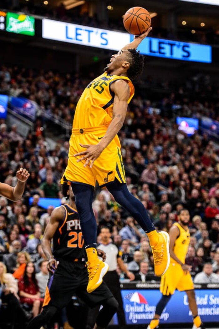 (Trent Nelson | The Salt Lake Tribune)  Utah Jazz guard Donovan Mitchell (45) grabs a rebound as the Utah Jazz host the Phoenix Suns, NBA basketball in Salt Lake City, Wednesday Feb. 14, 2018.