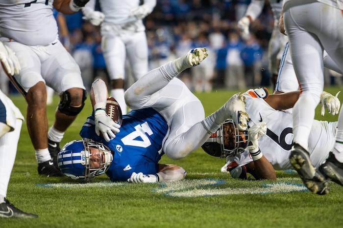 (Trevor Christensen | Special to The Tribune) Brigham Young University's Lopini Katoa is brought down by VirginiaÕs Nick Jackson during the second half at LaVell Edwards Stadium on Saturday, Oct. 30, 2021, in Provo.