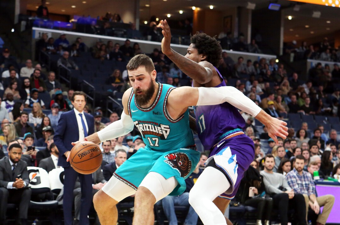 Memphis Grizzlies center Jonas Valanciunas (17) drives the ball past Utah Jazz center Ed Davis (17) in the first half of an NBA basketball game Friday, Nov. 29, 2019, in Memphis, Tenn. (AP Photo/Karen Pulfer Focht)