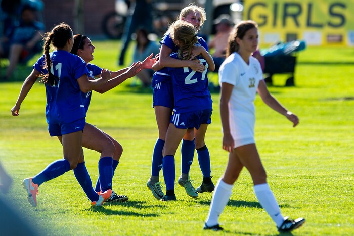 (Chris Detrick | The Salt Lake Tribune) Fremont's Brynlee Meyerhofer (16) and Fremont's Abbi Sanford (27) celebrate after winning the game at Angel Street Soccer Complex in Kaysville Thursday, August 24, 2017. Fremont defeated Davis 5-4 in double overtime.