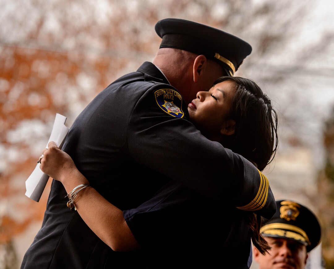 (Trent Nelson  |  The Salt Lake Tribune) South Salt Lake Police Chief Jack Carruth comforts Elizabeth Romrell after she spoke at the dedication ceremony of the David P. Romrell Public Safety Building on Sunday Nov. 24, 2019. The building is named after Officer Romrell (Elizabeth's husband), who was killed in the line of duty on Nov. 24, 2018 - one year ago.