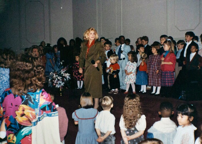 This undated photo provided in 2017 by a former member of the Word of Faith Fellowship shows founder Jane Whaley with children at the church in Spindale, N.C. Former members of the evangelical church say Whaley coerced congregants into filing false unemployment claims after the faltering economy threatened weekly tithes from church-affiliated companies. (AP Photo)