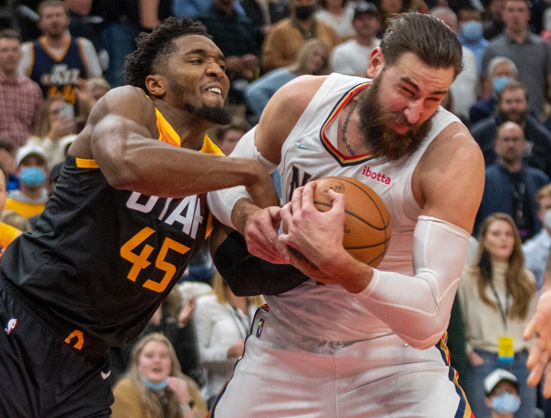 (Rick Egan | The Salt Lake Tribune) Utah Jazz guard Donovan Mitchell (45) battles New Orleans Pelicans center Jonas Valanciunas (17) for a rebound after missing his shot with just seconds left on the clock, in NBA action between the Utah Jazz and the New Orleans Pelicans, at Vivint Arena, in Salt Lake City, on Friday, Nov. 26, 2021.