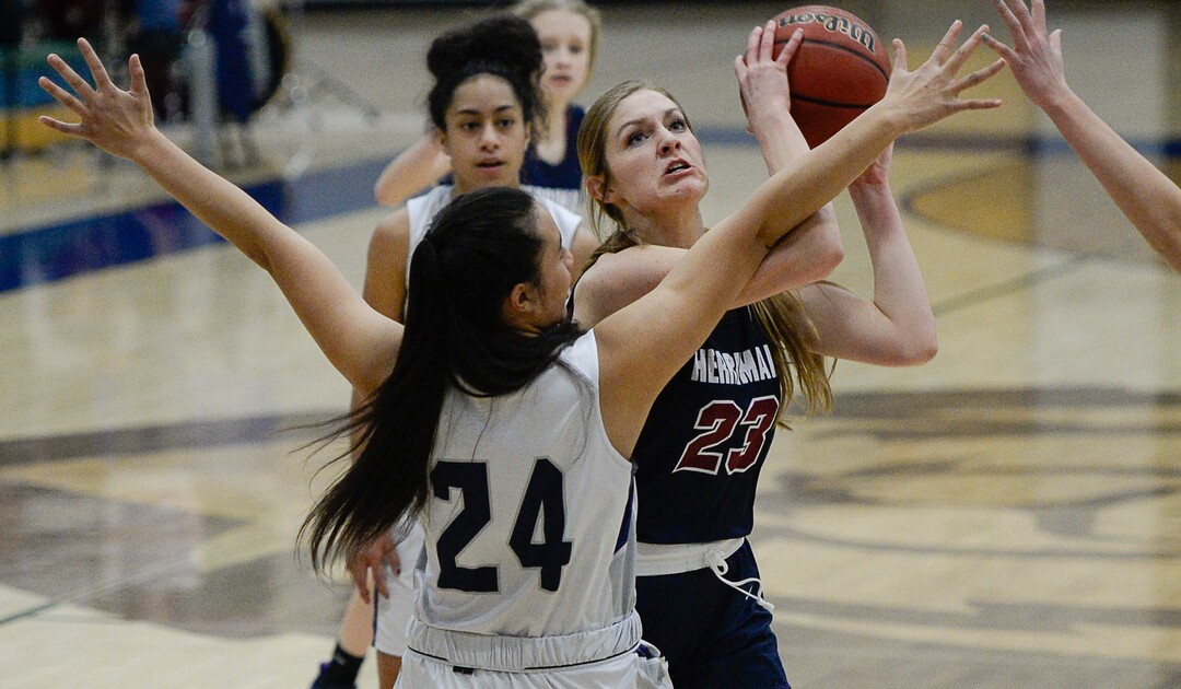 (Francisco Kjolseth  |  The Salt Lake Tribune)  Herriman's Samantha Jessop tries to get past Laci Olsen of Copper Hills  in game action in West Jordan on Thursday, Jan. 25, 2018.