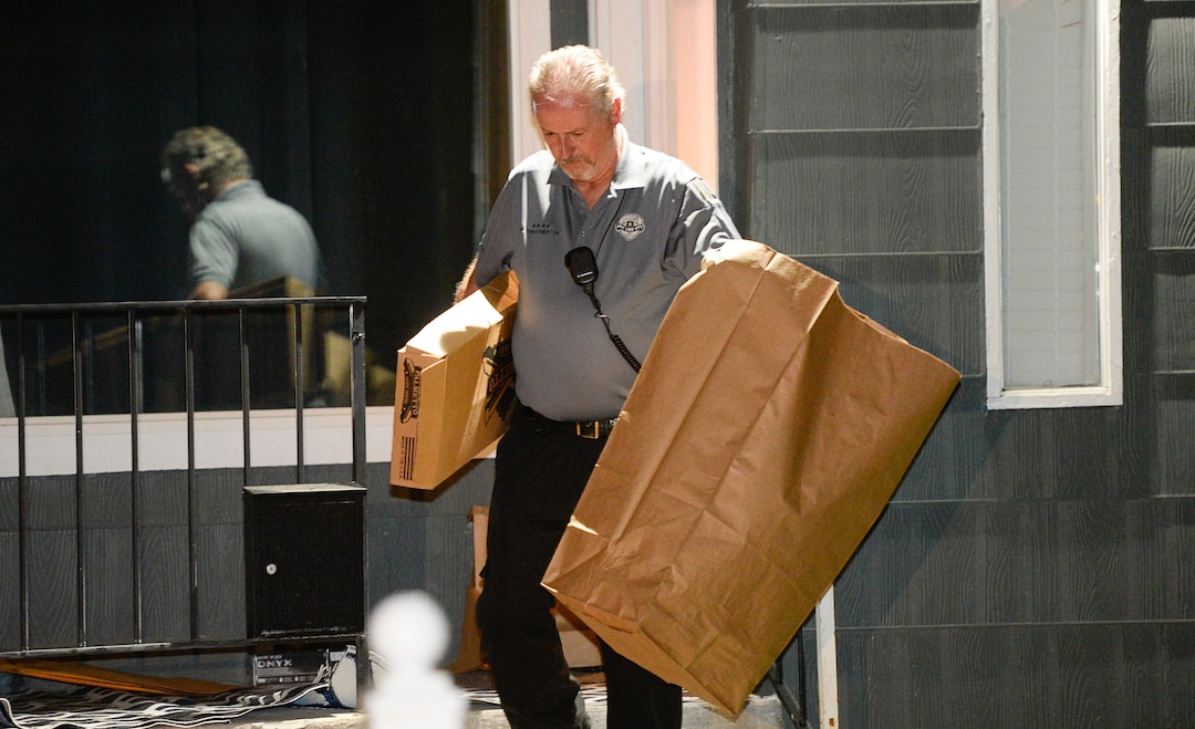 (Francisco Kjolseth  |  The Salt Lake Tribune)  Police investigators remove multiple bags of evidence during their search of a home at 547 N. 1000 West in Salt Lake City as part of the disappearance of University of Utah student MacKenzie Lueck that carried on into the early morning hours of Thursday, June 27, 2019.