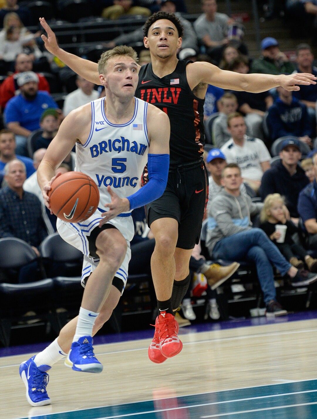 (Francisco Kjolseth  |  The Salt Lake Tribune)  Brigham Young Cougars guard Jake Toolson (5) pushes past UNLV Rebels guard Marvin Coleman (31) as BYU takes on UNLV in men's NCAA basketball at Vivint Smart Home Arena in Salt Lake City on Sat. Dec. 7, 2019.