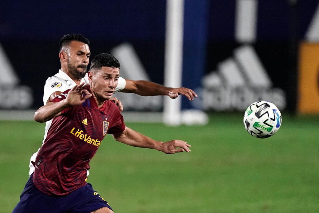Real Salt Lake's Damir Kreilach, front, and Los Angeles Galaxy's Giancarlo Gonzalez chase the ball during the first half of an MLS soccer match, Sunday, Nov. 1, 2020, in Carson, Calif. (AP Photo/Jae C. Hong)