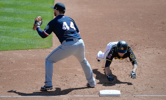 (Francisco Kjolseth  |  The Salt Lake Tribune)  Bees player Brennon Lund manages to be quick on his feet as he gets back to first base past Joey Culetta of the Rainiers during their game at Smith's Ballpark on Thursday, May 2, 2019.