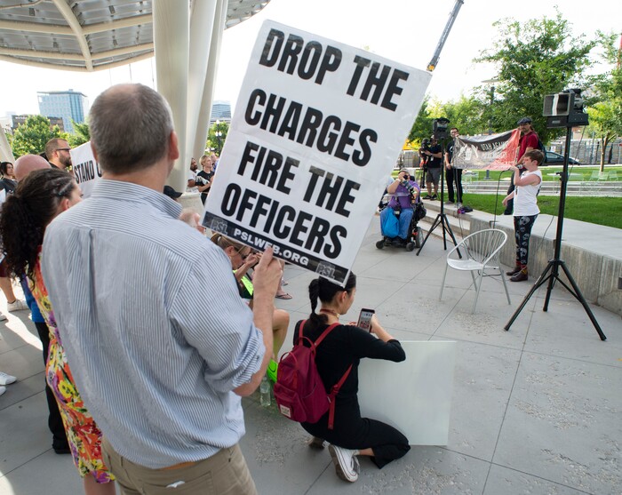 (Rick Egan  |  The Salt Lake Tribune)     Protesters shout "stand up fight back" during a rally sponsored by Utah Against Police Brutality, which included several protesters that talked about their experience being attacked by Salt Lake City Policemen, at the Inland port protest.
Tuesday, July 23, 2019.