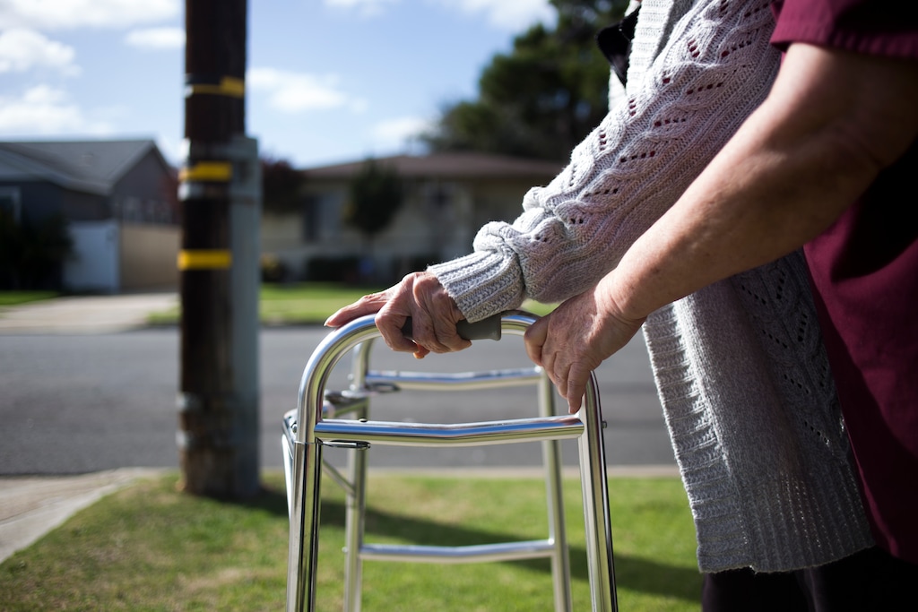 (Jenna Schoenefeld | The New York Times)

Caregiver Guadalupe Mercado keeps her hand on Olive Tanaka's walker during a walk near Tanaka's home in Gardena, Calif., on Feb. 12, 2018.
