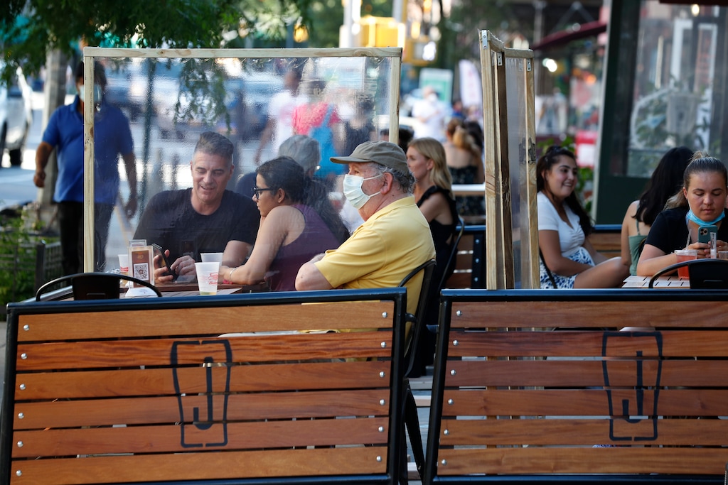 (Kathy Willens | AP) Plastic partitions separate patrons at Jake's Dilemma the first day of the phase two reopening of the city during the current coronavirus outbreak, Monday, June 22, 2020, in New York. In phase two, restaurants are allowed have customers seated for outdoor dining but with some restrictions.