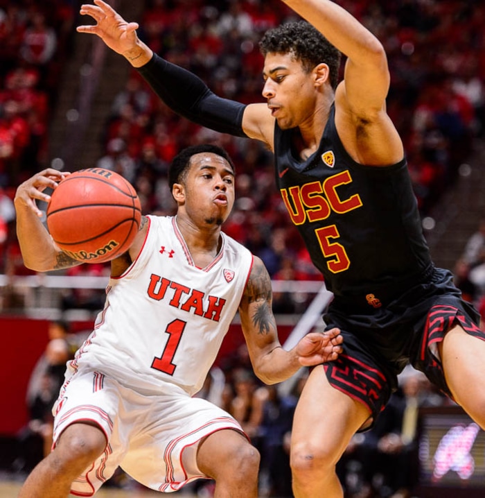 (Trent Nelson | The Salt Lake Tribune)  USC Trojans guard Derryck Thornton (5) steals the ball from Utah Utes guard Justin Bibbins (1) as the University of Utah hosts USC, NCAA basketball at the Huntsman Center in Salt Lake City, Saturday Feb. 24, 2018.