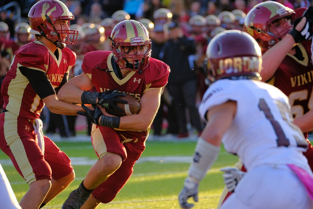 (Leah Hogsten  |  The Salt Lake Tribune) Viewmont's quarterback Davis Weir hands off to Cameron Brown against Jordan during their playoff game.