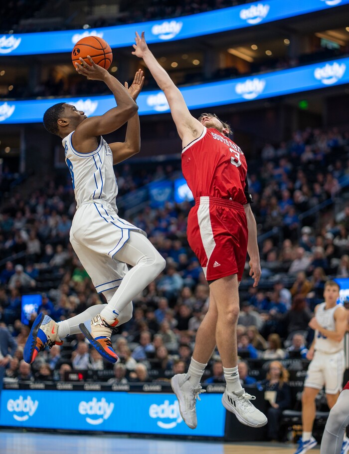 (Rick Egan | The Salt Lake Tribune)  Brigham Young Cougars guard Rudi Williams (3) shoots as South Dakota Coyotes guard Max Burchill (3) defends, in basketball action between the Brigham Young Cougars and the South Dakota Coyotes, at Vivint Arena, in Salt Lake City, on Saturday, Dec. 3, 2022.
