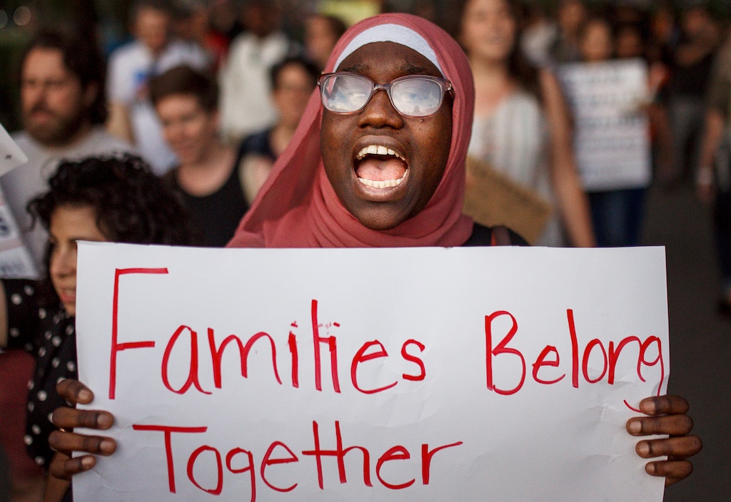 A woman shouts slogans during a rally against a banning travel from several Muslim-majority nations on Tuesday, June 26, 2018, in New York. Muslim individuals and groups, as well as other religious and civil rights organizations, expressed outrage and disappointment at the U.S. Supreme Court's decision Tuesday to uphold President Donald Trump's ban on travel from several mostly Muslim countries. (AP Photo/Andres Kudacki)