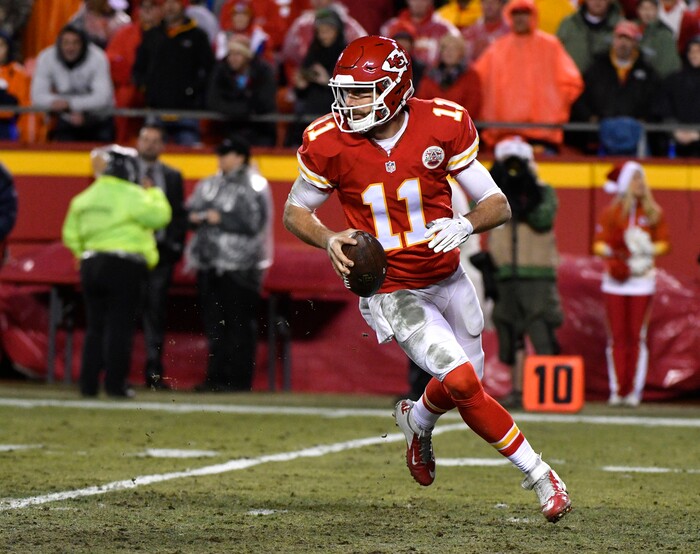 Kansas City Chiefs quarterback Alex Smith (11) runs with the ball during the second half of an NFL football game against the Denver Broncos in Kansas City, Mo., Sunday, Dec. 25, 2016. (AP Photo/Ed Zurga)