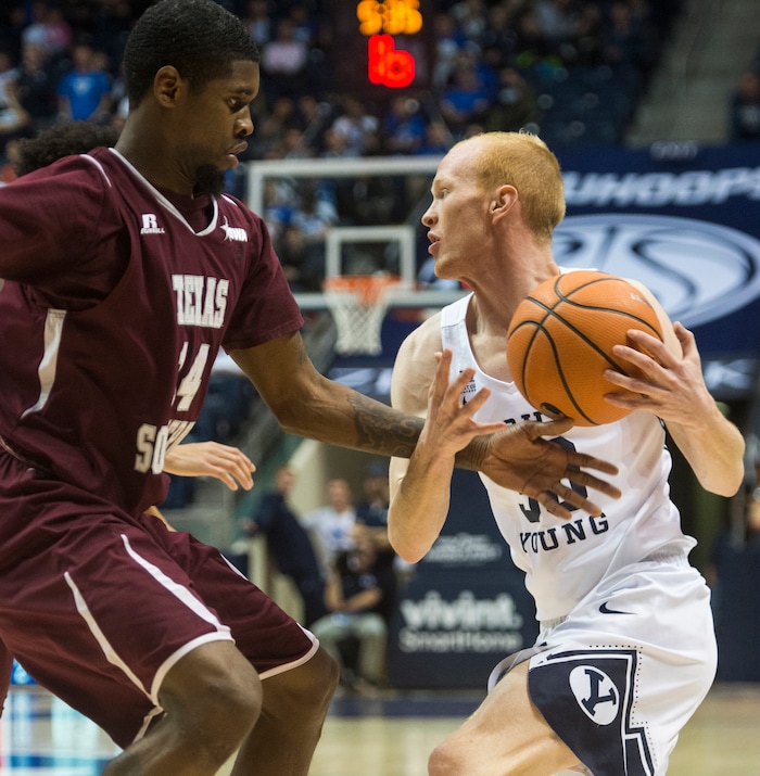 (Rick Egan  |  The Salt Lake Tribune)   Brigham Young Cougars guard TJ Haws (30) tries to get past Texas Southern Tigers forward Lamont Walker (14), in basketball action, Brigham Young Cougars vs Texas Southern Tigers, at the Marriott Center in Provo, Saturday, December 23, 2017.