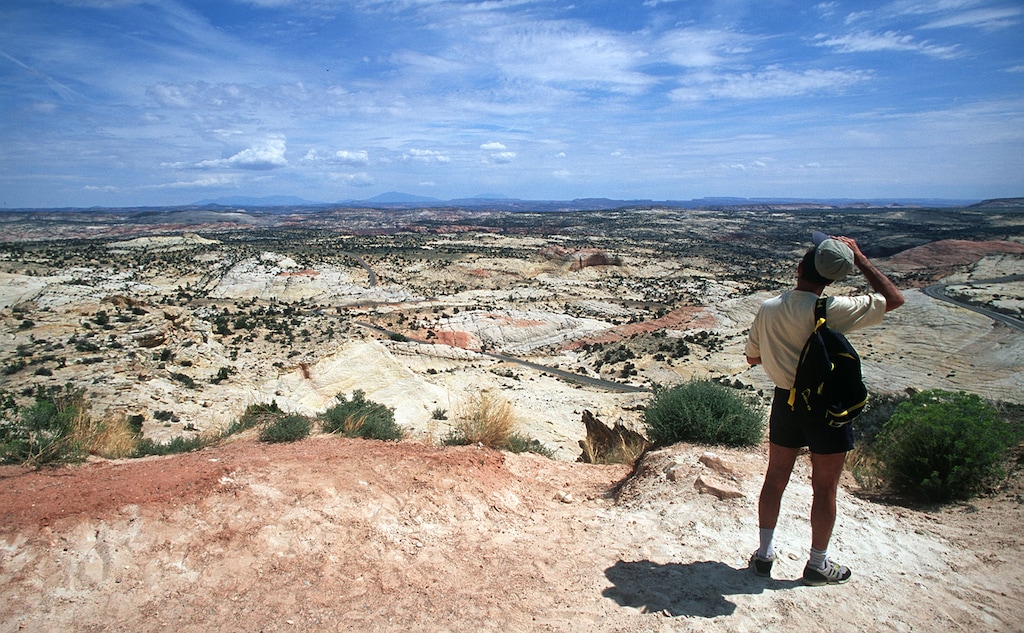 (Al Hartmann | Tribune File Photo) A tourist looking out at the view of the Escalante Canyons from Scenic Byway 12. A proposed Senate bill in the 2024 general session could give outdoor advertisers more say in the management of scenic byways like this one statewide.
