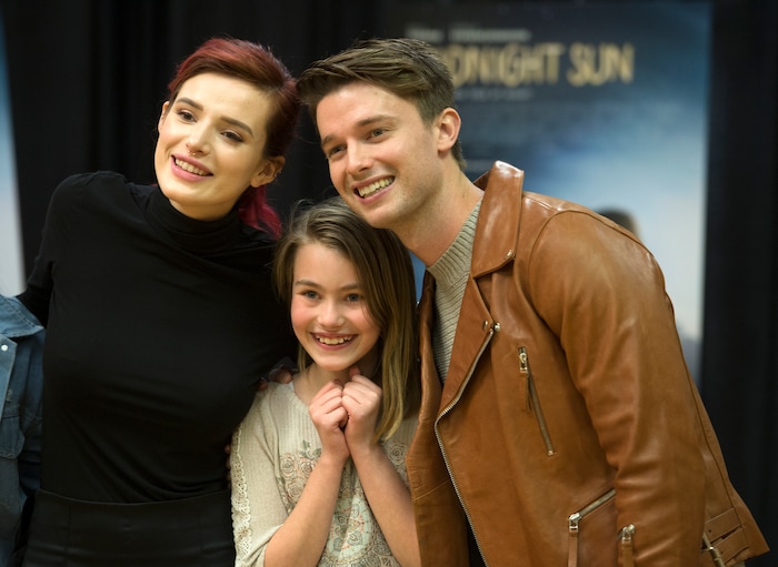 (Leah Hogsten  |  The Salt Lake Tribune) Actors Bella Thorne and Patrick Schwarzenegger pose with star-struck fan Aurora Christensen. Thorne and Schwarzenegger autographed posters and met fans to promote their upcoming young-adult romance, "Midnight Sun," during a stop at the Fashion Place Mall in Murray on Tuesday, March 6, 2018. The movie opens March 23.