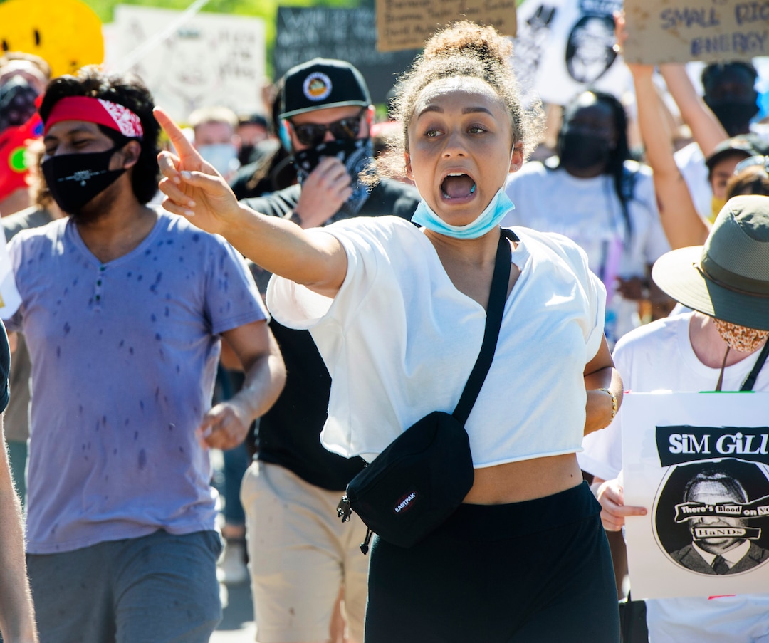 (Rick Egan  |  The Salt Lake Tribune)     Bella Swan sings as she dances to Aretha Franklin, as protesters dance on Football drive during a march for Justice onSunday, July 12, 2020.
