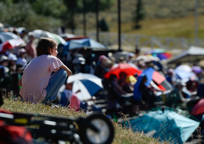 (Francisco Kjolseth | The Salt Lake Tribune) A young spectator takes in the Australian shepherd sheep drive down the hill and through numerous challenges as part of the annual Soldier Hollow Classic on Monday, Sept. 2, 2019.