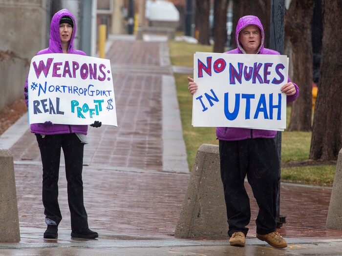 (Rick Egan  |  The Salt Lake Tribune)   
Chelsea Page and Marcus Collonge hold signs during a picketing party against Northrop Grumman, on 400 West and 100 South across from the Clark Planetarium in Salt Lake City, Sunday, Dec. 8, 2019.