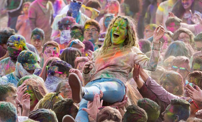 (Rick Egan  |  The Salt Lake Tribune)       Revelers body surf  to the sounds of Luminaries, during the 22nd annual Holi Festival of Colors at the Sri Sri Radha Krishna Temple in Spanish Fork, Saturday, March 24, 2018. The festival which celebrates the beginning or spring is also known as at the Festival of Love.