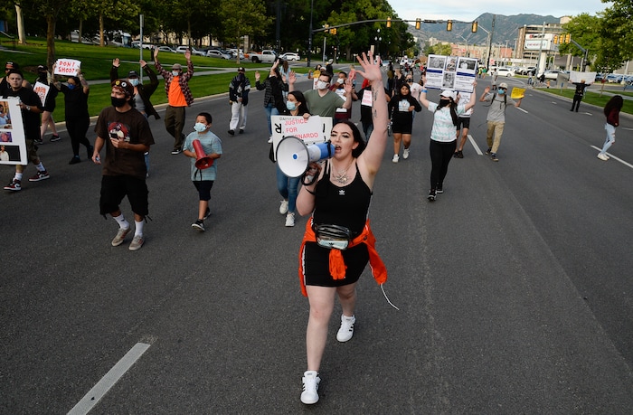 (Francisco Kjolseth  |  The Salt Lake Tribune) Sofia Alcala leads the crowd as they chant during a Rally for Bernardo Palacios, blocking traffic along 500 S. in front of the Salt Lake County District Attorney's office on Thursday, June 18, 2020.